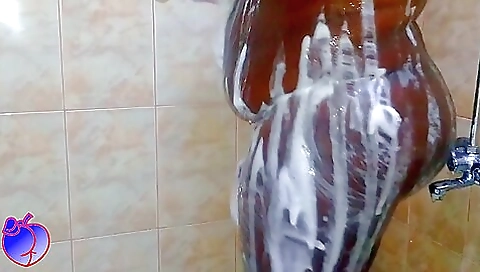 Black beauty in the shower is showing her wet body