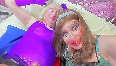 Blonde milf with big tits playing with a dildo in lingerie