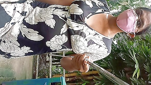 A hot amateur woman with big tits is walking in the park